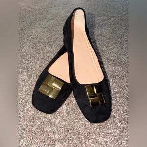 Elegant Black Flats with Gold Accents